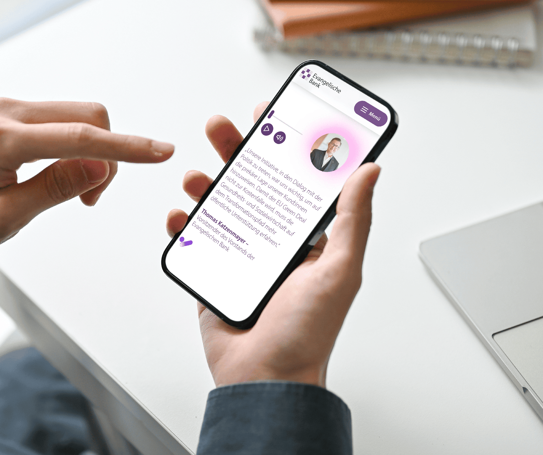 User reads Evangelische Bank's digital annual report on their smartphone - modern responsive design for mobile corporate communication.