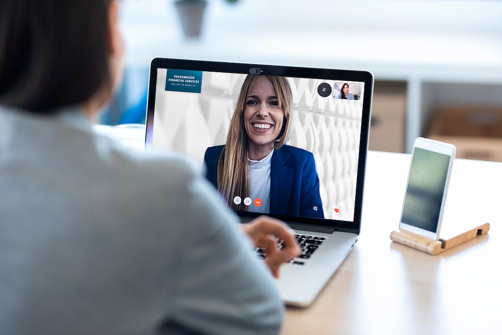 female-employee-speaking-on-video-call-with-her-co-XEPGYAJ_mod-min